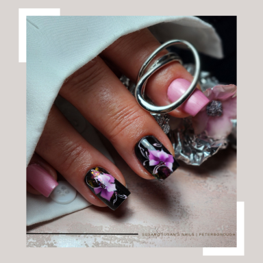 Short black and pink square nails with freehand painted one stroke flowers